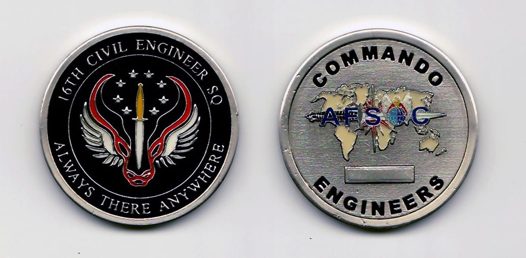 Round shaped, silver colored coin 1-1/2 inches in diameter.