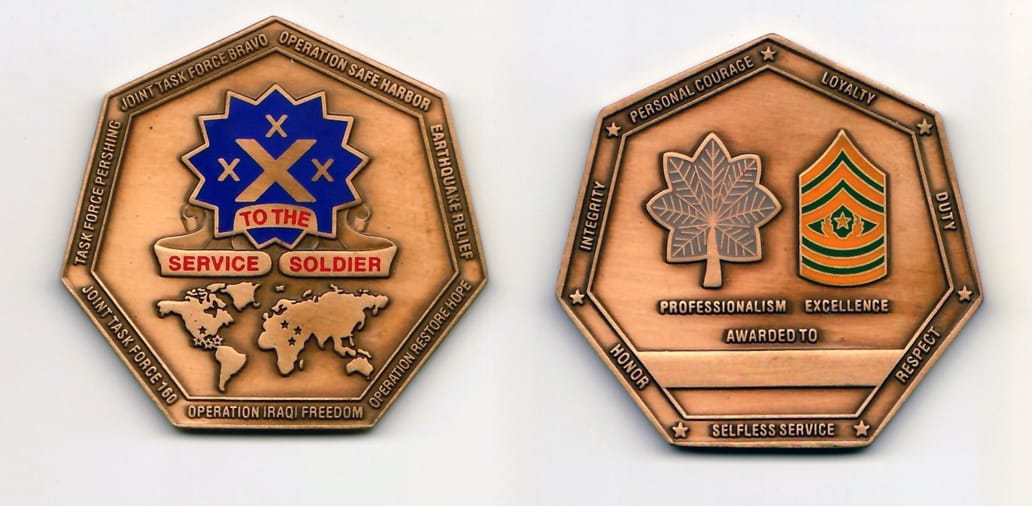 Heptagon shaped, antique brass colored coin 2 inches in diameter.