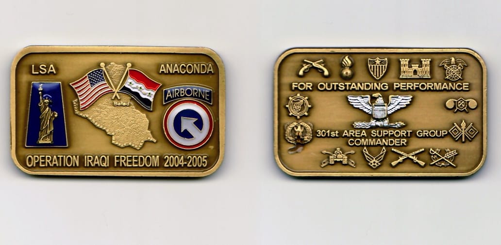 Rectangular shaped, with rounded corners, antique brass colored coin 2- 5/16 inches wide by 1- 3/8 inches high.