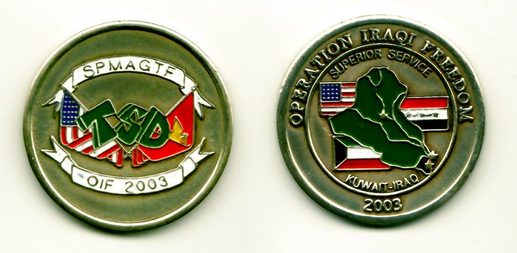 Round shaped, light brass color, 1-11/16 inches in diameter.