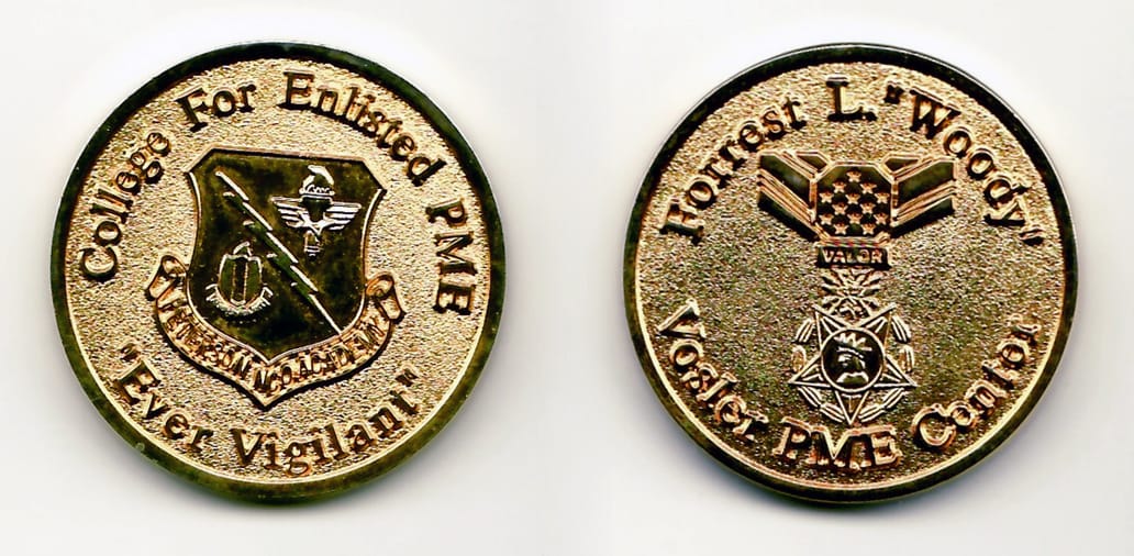 Round shaped, gold colored coin, 1½ inches in diameter.