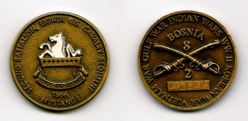 Round shaped, dark brass coin 1-7/16 inches in diameter.