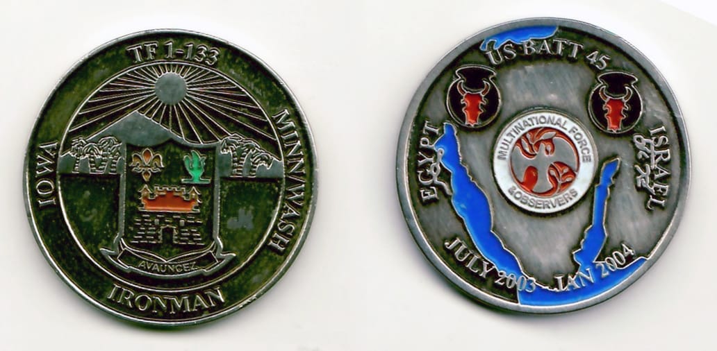 Round shaped, pewter colored coin 1-7/16 inches in diameter.