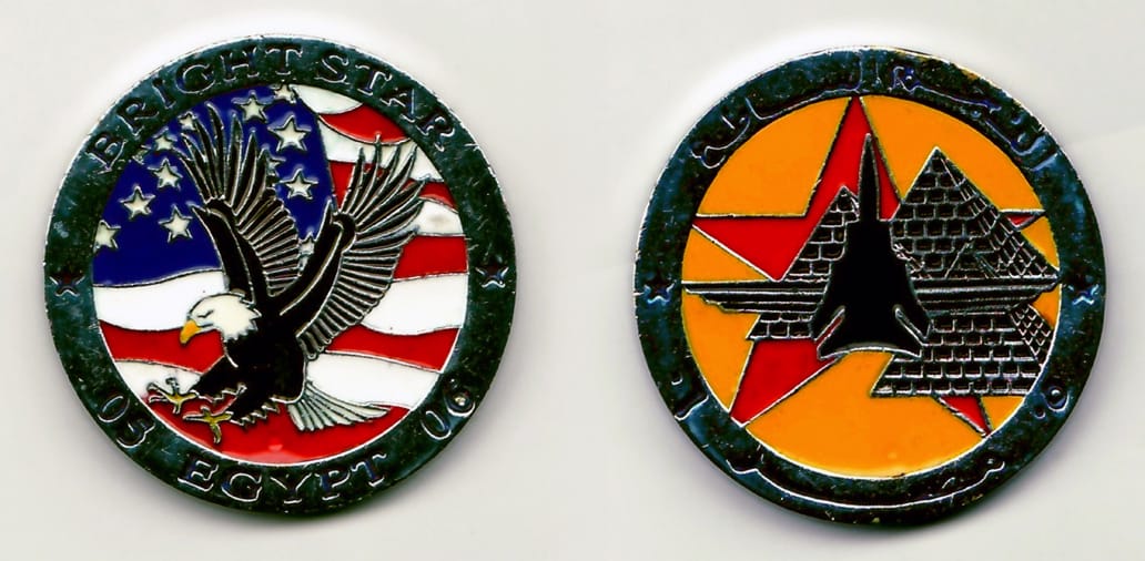 Round shaped, chrome colored coin 1¾ inches in diameter.