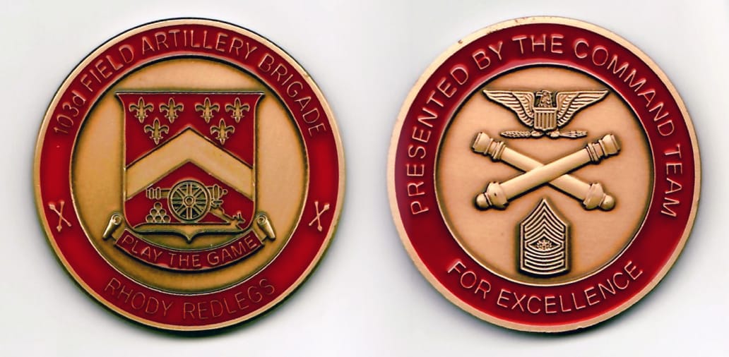 Round shaped, brass, gold edged coin 1-11/16 inches in diameter.