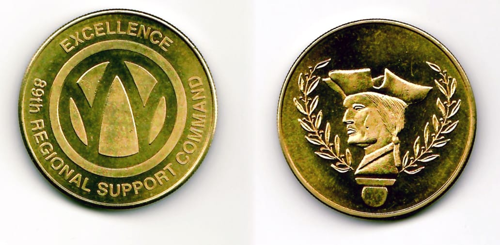 Round shaped, yellow gold colored coin 1-9/16 inches in diameter.