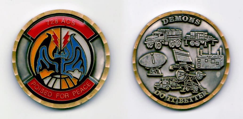 Round shaped, silver colored coin with gold colored rim, 1-9/16 inches in diameter.