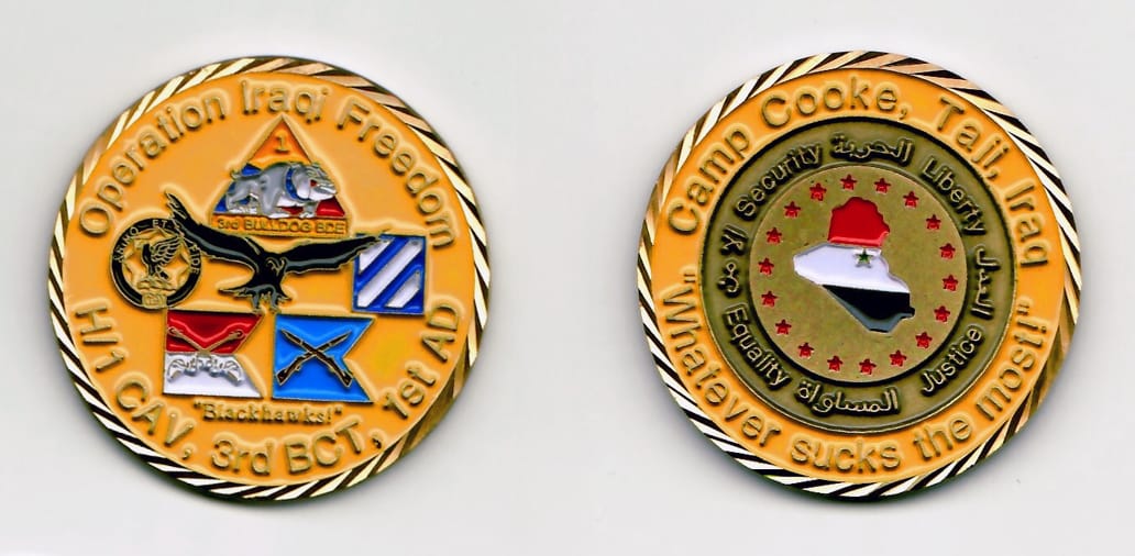 Round shaped, brass colored coin with gold colored rim, 1¾ inches in diameter.