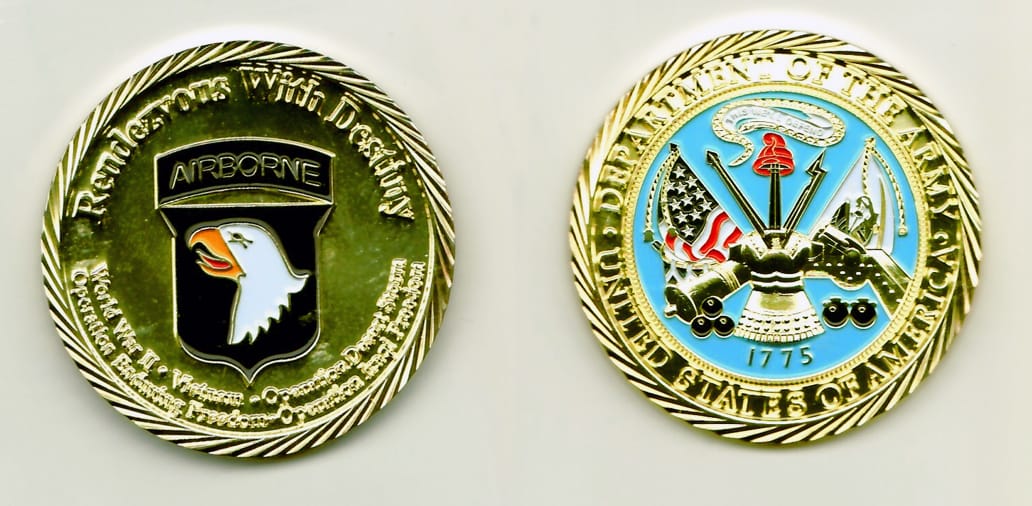 Round shaped, gold colored coin 2 inches in diameter.