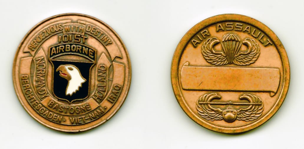 Round shaped, antique brass colored coin 1-5/8 inches in diameter.