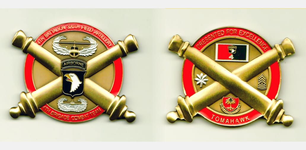 Round shaped, with two crossed cannons protuding from sides, gold colored coin - circular part of coin is 1¾ inches in ...