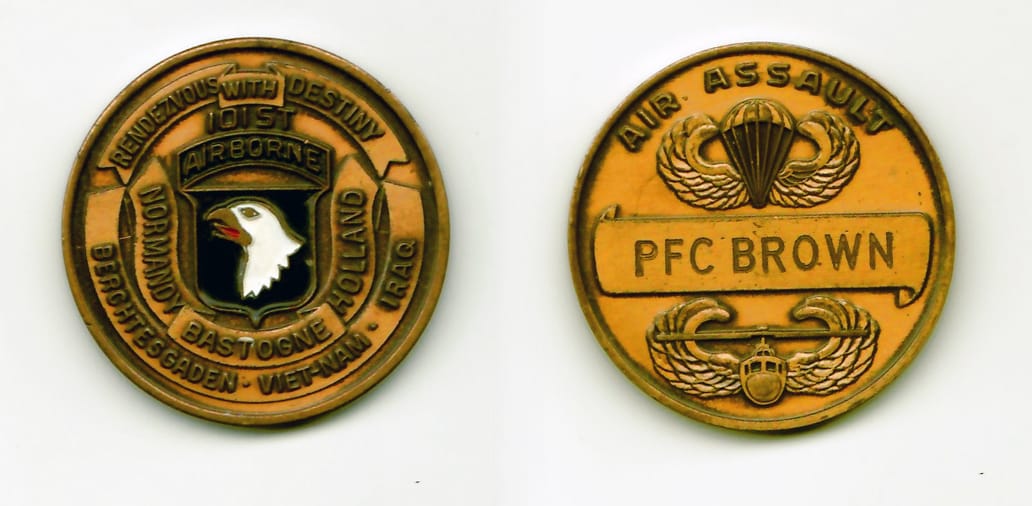 Round shaped, antique brass colored coin 1-5/8 inches in diameter.