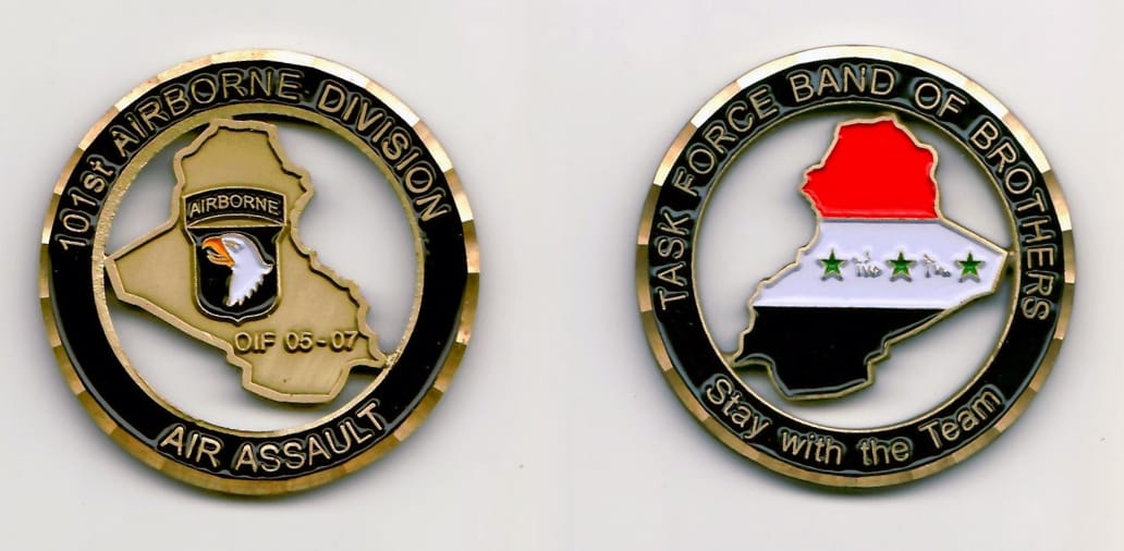 Round shaped, brass colored coin 1-7/8 inches in diameter with cutout areas.