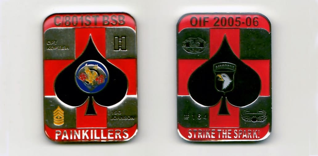 Retangular shaped, gold colored coin with rounded corners, 1-1/4 inches wide x 1-3/4 high.