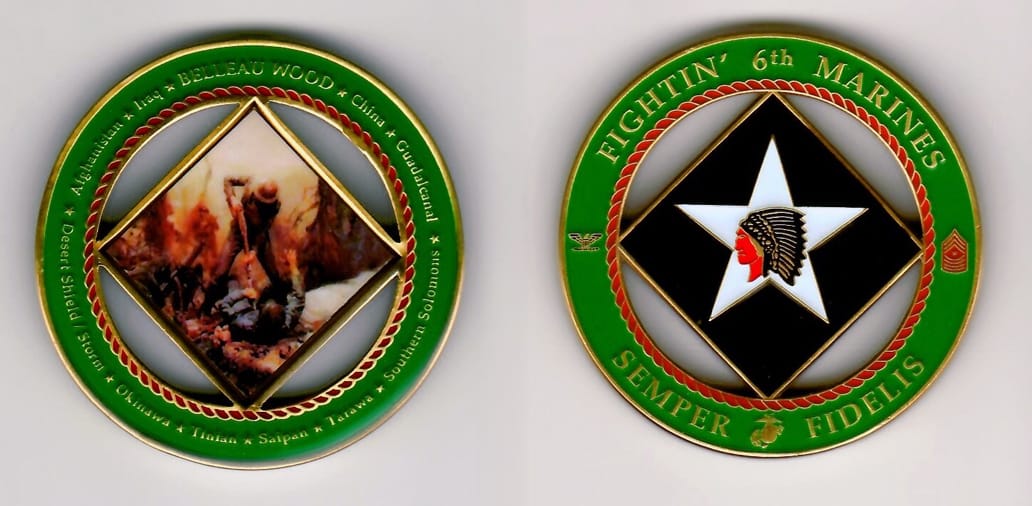 Round shaped, brass colored coin with cut out areas, 2 inches in diameter.