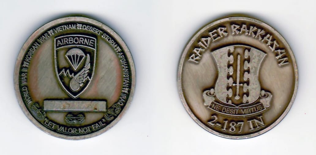 Round shaped, antique brass colored coin 2 inches in diameter.