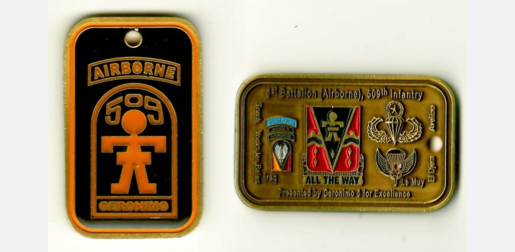 Retangular shaped, antique brass colored coin with rounded corners, 2-1/4 inches wide x 2-1/4 inches high.