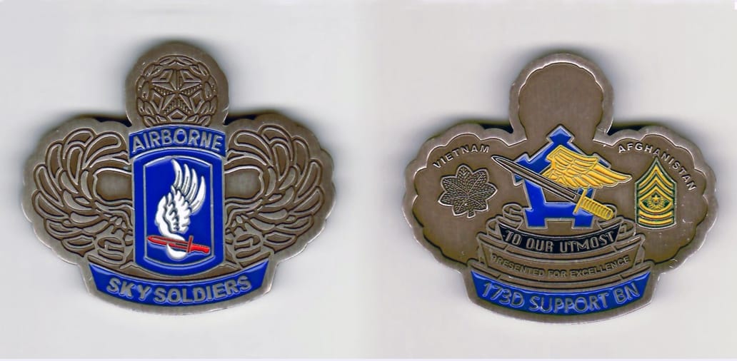 Master airborne wings shaped, pewter colored coin, with banner beneath,  2 inches wide x 2-1/4 inches high.