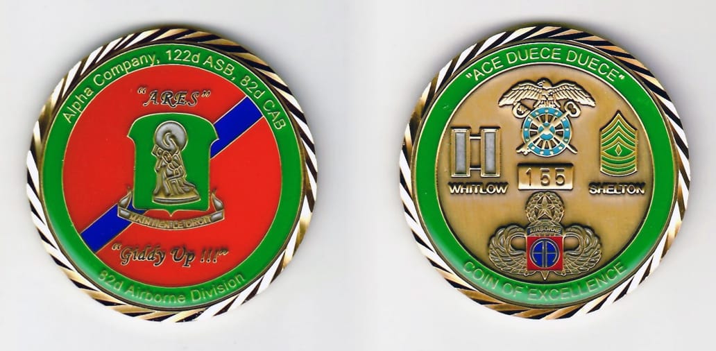 Round shaped, gold colored coin 2 inches in diameter.