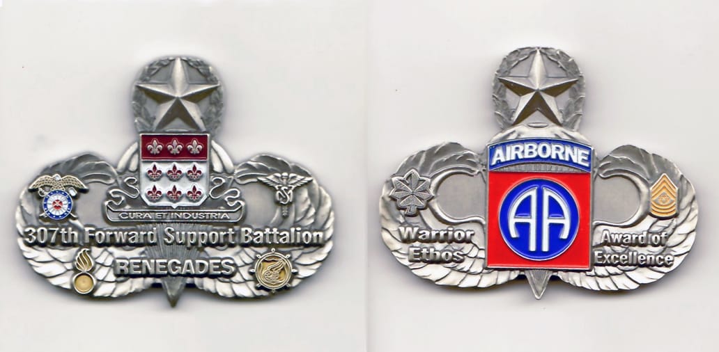 Master airborne wings shaped, pewter colored coin 2-1/2 inches wide x 2 inches high.