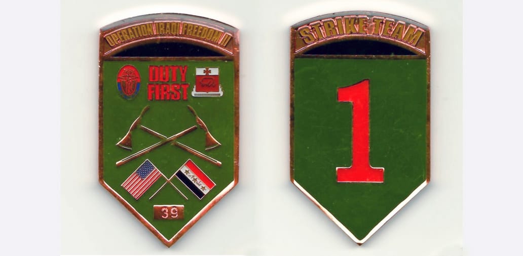 Shield shaped with pointed bottom and rounded top, copper colored coin, 1-1/2 inches wide x 2-1/2 inches high.