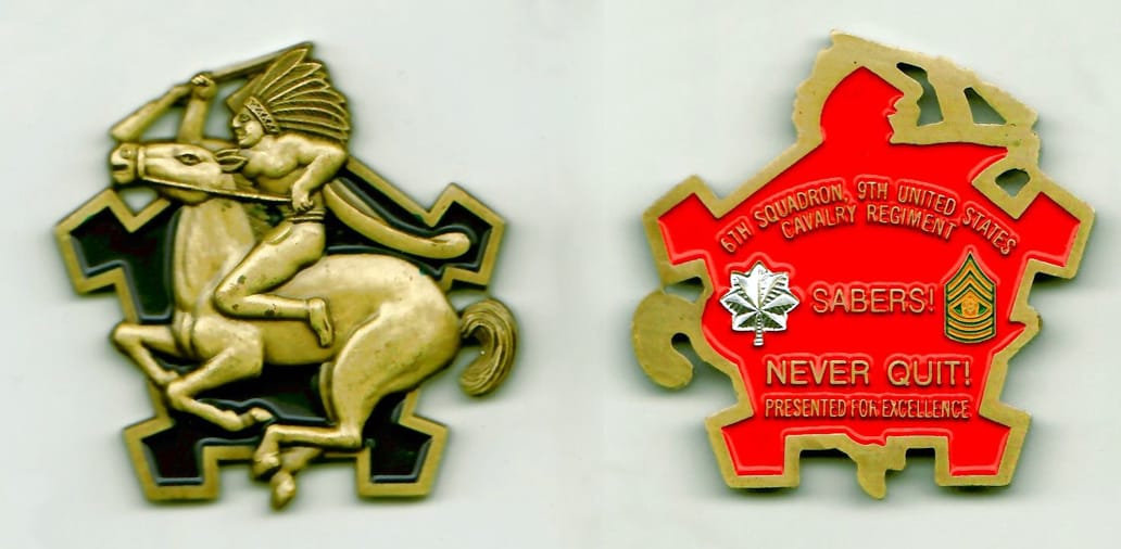 Indian mounted on a galloping horse with an angular background shaped,  brass colored coin 2 inches wide x 2 inches high...