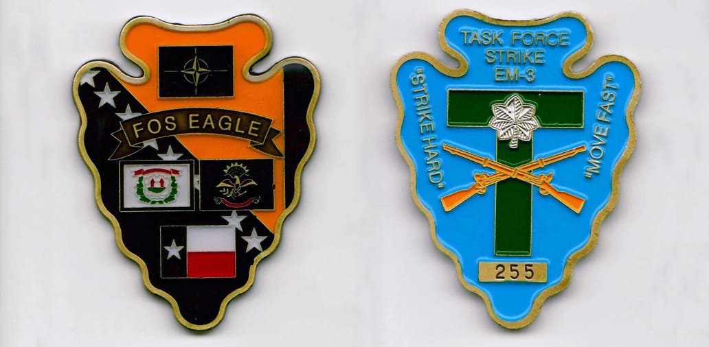 Arrowhead shaped, gold colored coin 2 inches wide x 2-1/2 inches high.