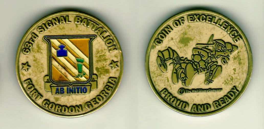 Round shaped, brass colored coin 1-3/4 inches in diameter.