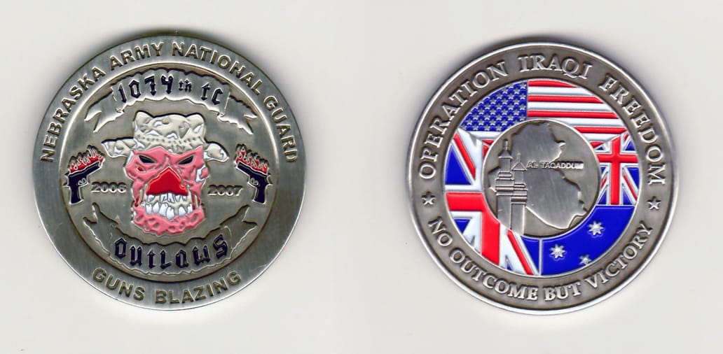 Round shaped, pewter colored coin 1-15/16 inches in diameter.