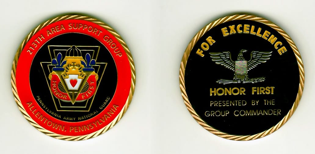 Round shaped, gold colored coin 1-15/16 inches in diameter.