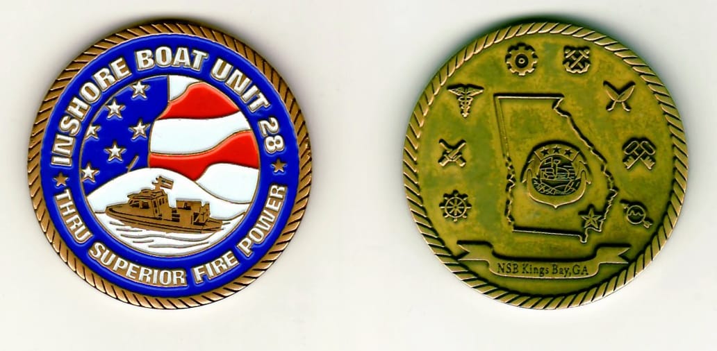 Round shaped,  brass colored coin 1-9/16 inches in diameter.