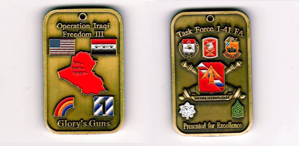 Dog taged shaped, antique brass colored coin 1-1/4 inches wide x 2 inches high.