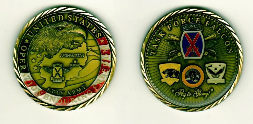 Round shaped, antique brass colored coin 2 inches in diameter.