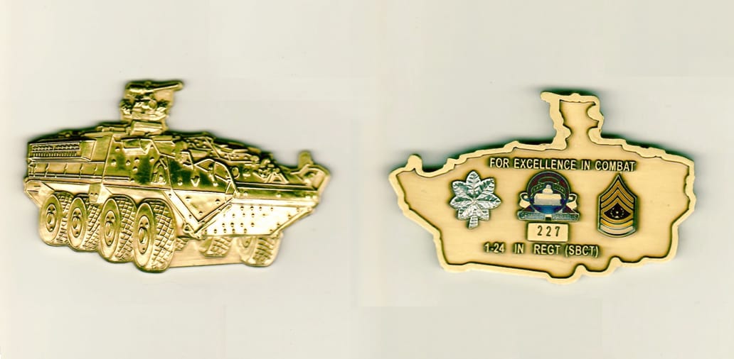 Tank shaped, antique brass colored coin 3 inches wide x 1-3/4 inches high.