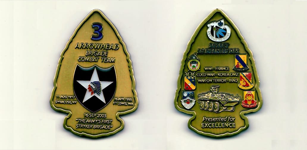 Arrowhead shaped, antique brass colored coin 1-3/4 inches wide x 2-1/2 inches high.