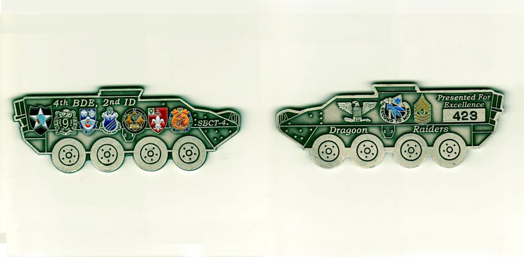 Armored personel carrier shaped, pewter colored coin, 3-1/2 inches wide x 1-1/4 inches high.
