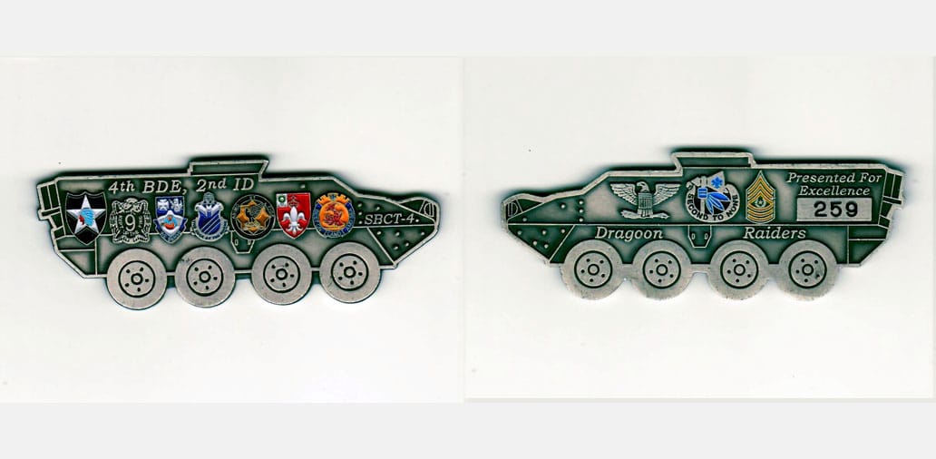 Armored personel carrier shaped, pewter colored coin, 3-1/2 inches wide x 1-1/4 inches high.