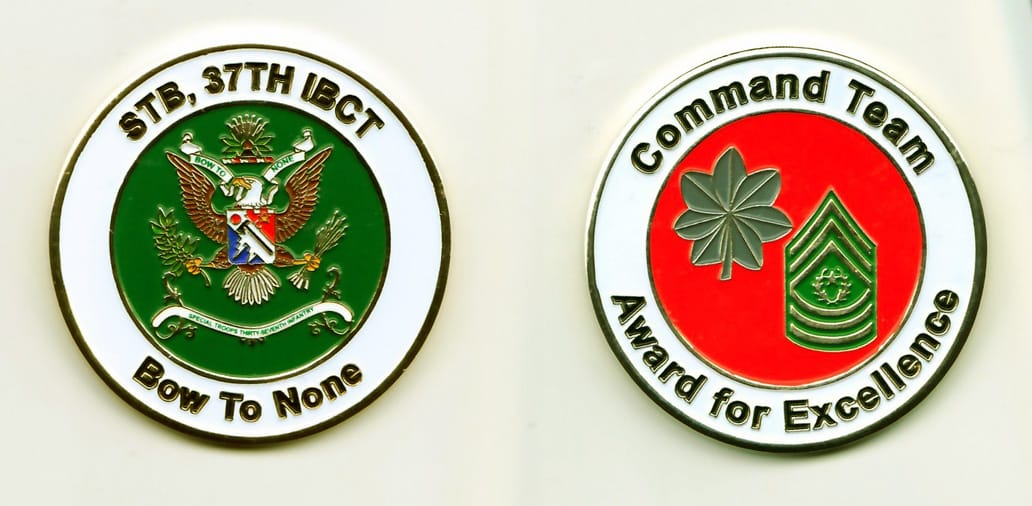 Round shaped, gold colored coin, 2 inches in diameter.