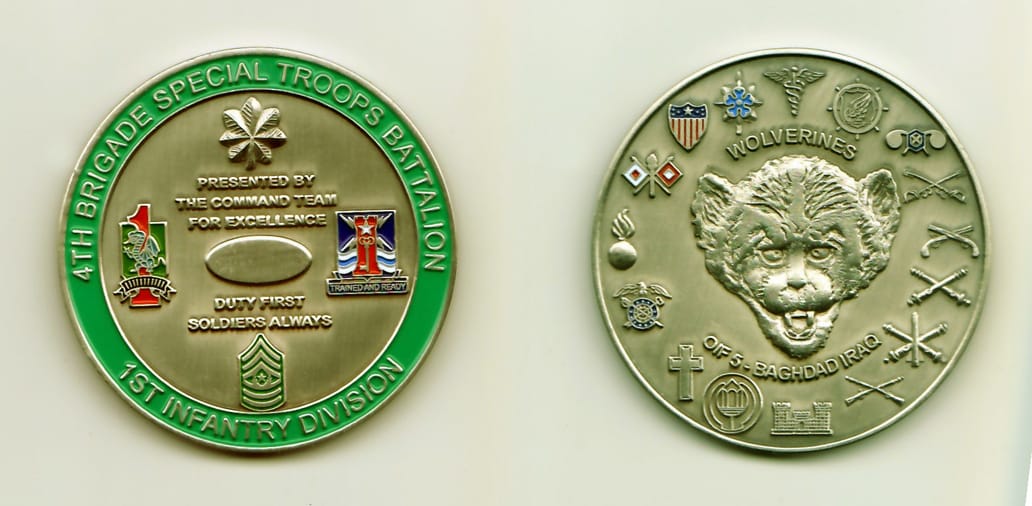 Round shaped, pewter colored coin, 2 inches in diameter.