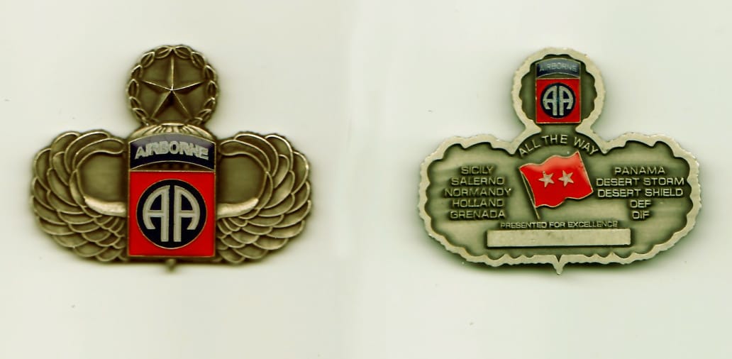 Master Airborne wings shaped, pewter colored coin, 2 inches wide x 1-5/8 inches high.