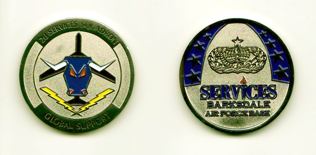 Round shaped, silver colored coin, 1-3/4 inches in diameter.