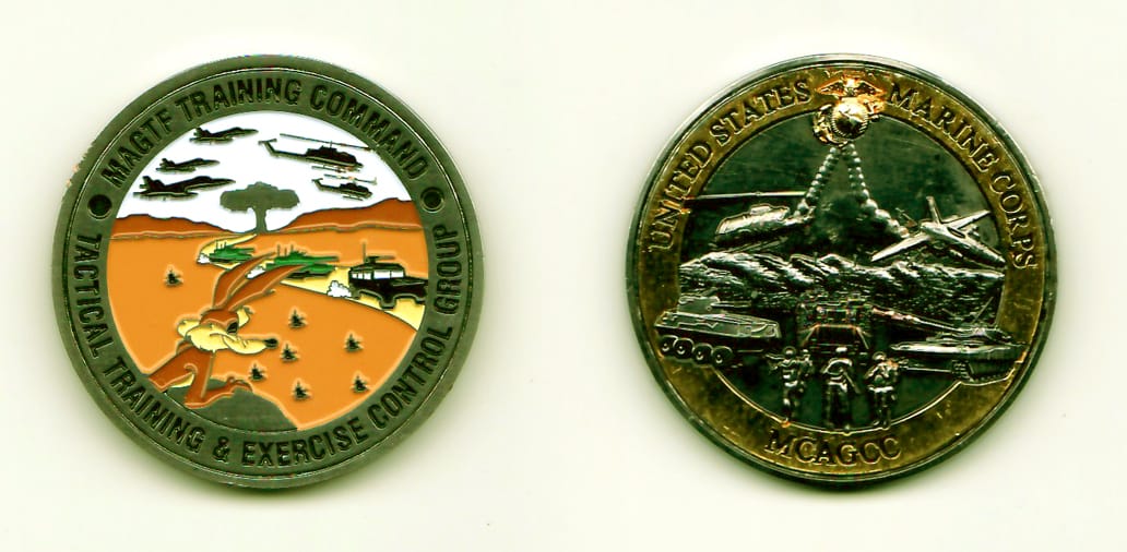 Round shaped, pewter colored coin, 1-3/4 inches in diameter.