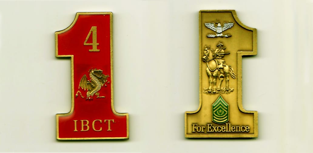 The number one shaped, gold colored coin, 1-1/4 inches wide x 2-1/4 inches high.