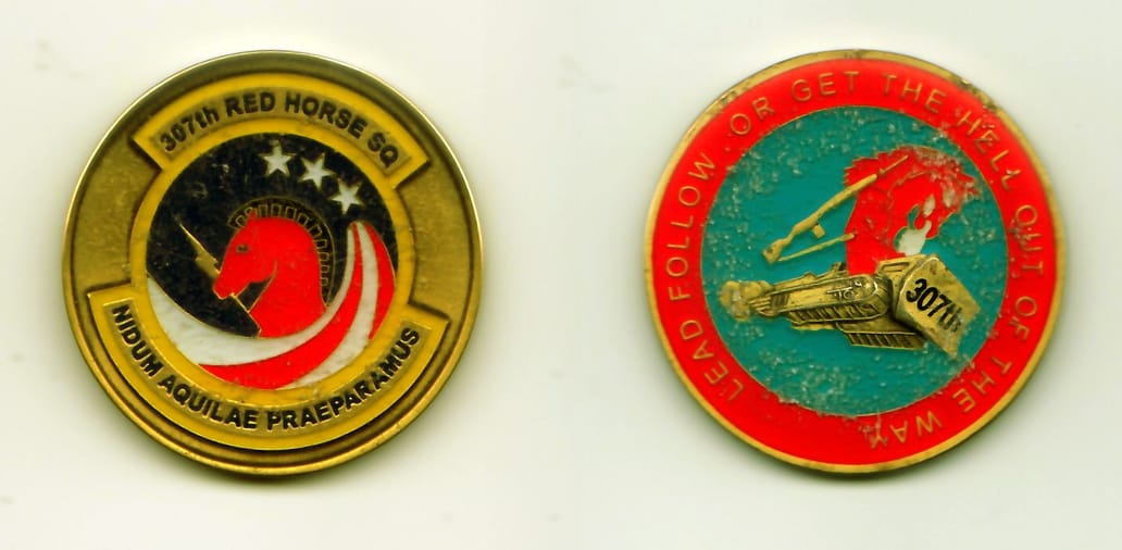 Round shaped, gold colored coin, 1-3/4 inches in diameter.