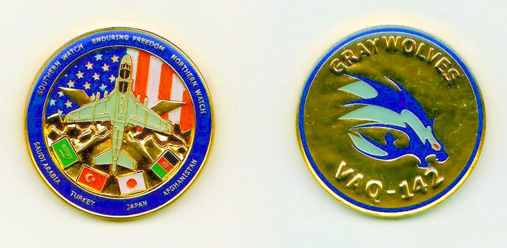 Round shaped, gold colored coin, 1-11/16 inches in diameter.