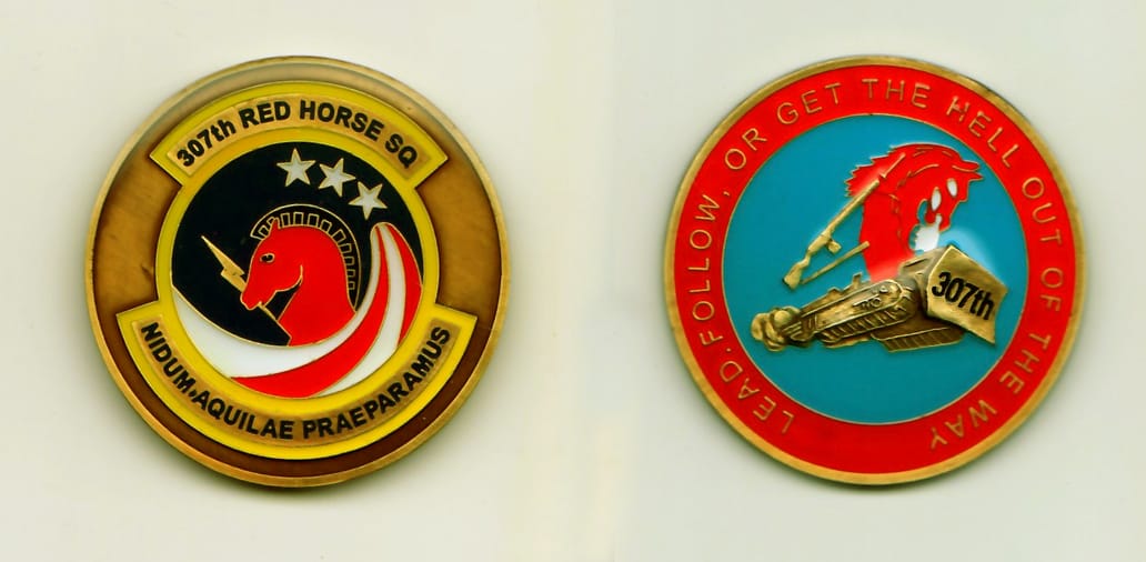 Round shaped, gold colored coin, 1-3/4 inches in diameter.