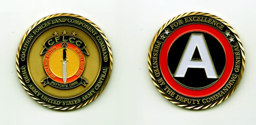 Round shaped, bronze colored coin, with gold rim, 2 inches in diameter.