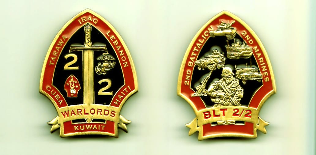 Arrowhead shaped, brass colored coin, 1-1/2 inches wide x 1-15/16 inches high.