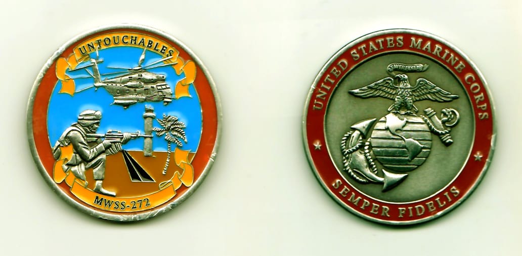 Round shaped, pewter colored coin, 1-3/4 inches in diameter.