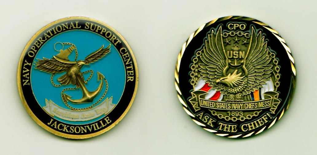 Round shaped, brass colored coin with a gold rim, 1-3/4 inches in diameter.